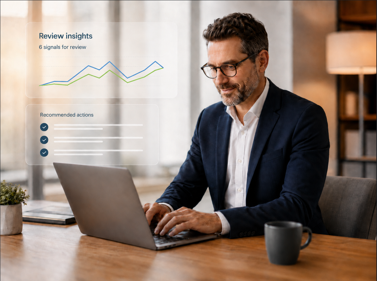 Executive reviewing risk insights and recommended actions on a laptop